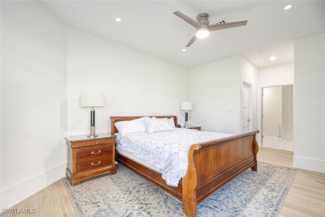 bedroom featuring light wood-style floors, recessed lighting, ceiling fan, and baseboards