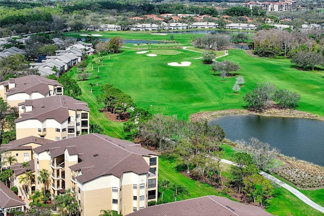 bird's eye view featuring view of golf course and a water view