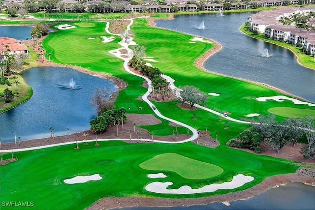 aerial view with view of golf course and a water view