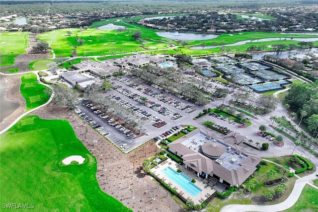 aerial view featuring view of golf course and a water view