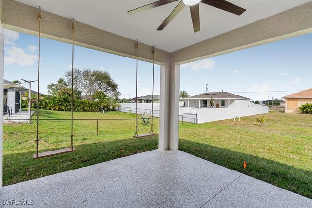 view of patio / terrace with fence and ceiling fan