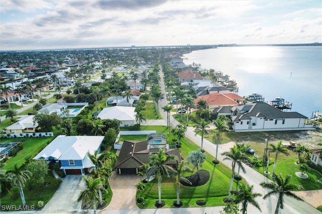 bird's eye view featuring a water view and a residential view