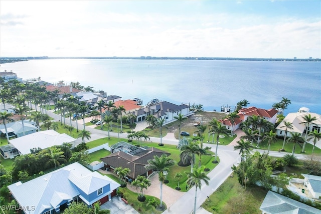 bird's eye view featuring a residential view and a water view