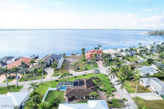 bird's eye view with a water view and a residential view