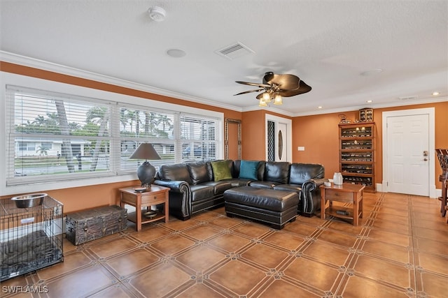 living room with plenty of natural light, visible vents, and crown molding