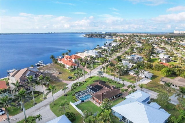 bird's eye view featuring a water view and a residential view