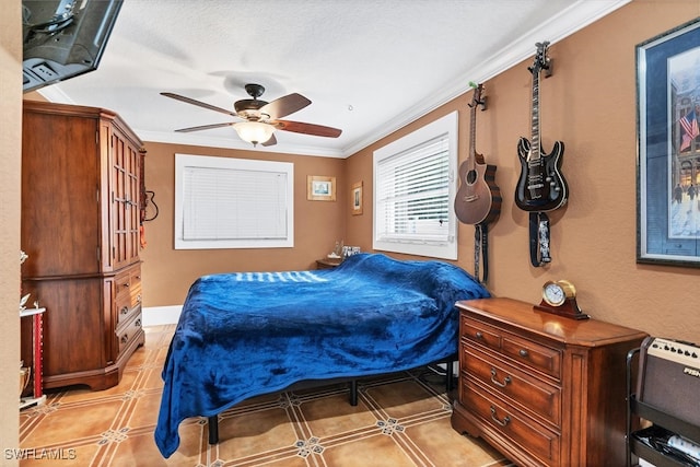 bedroom featuring baseboards, ornamental molding, and a ceiling fan