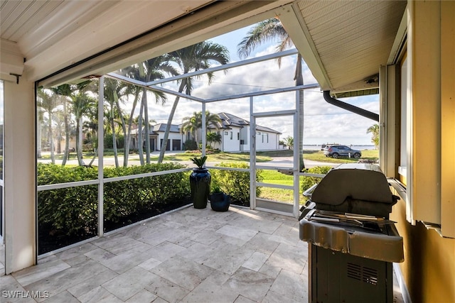 unfurnished sunroom with a residential view