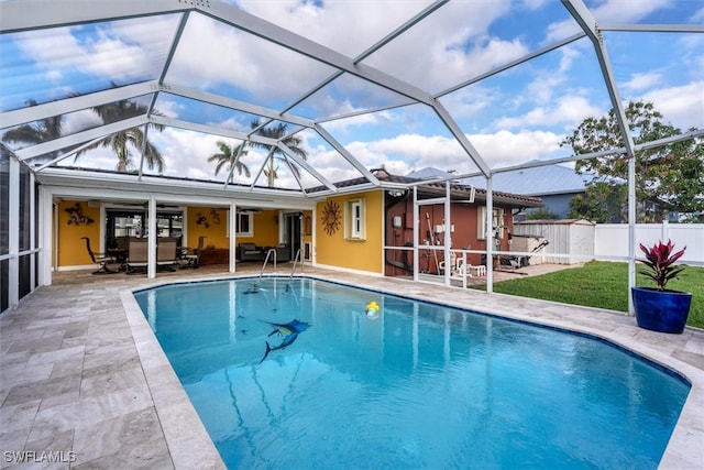 view of pool featuring a fenced in pool, a yard, glass enclosure, a patio area, and fence