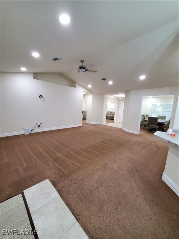 carpeted living area with recessed lighting, visible vents, vaulted ceiling, and baseboards