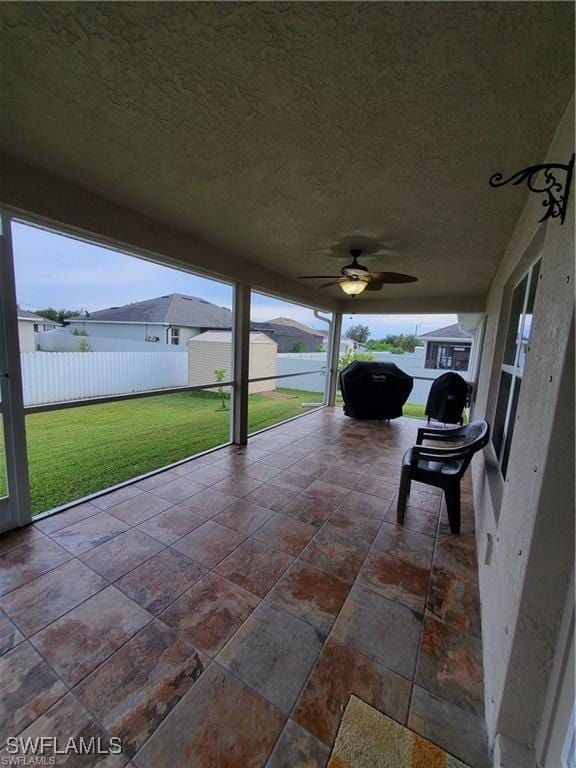 view of patio / terrace featuring fence