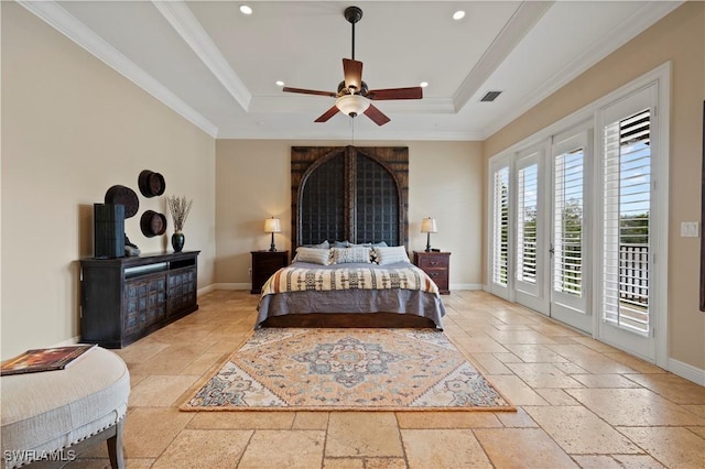 bedroom with visible vents, access to exterior, baseboards, a tray ceiling, and stone tile flooring