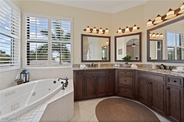 bathroom with ornamental molding, tile patterned floors, a sink, and double vanity