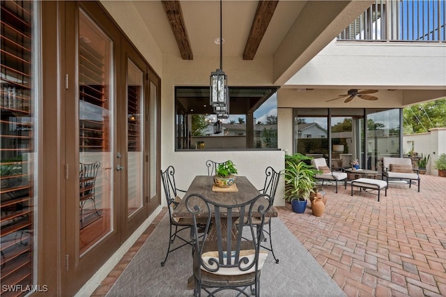 view of patio featuring ceiling fan, french doors, and outdoor dining space