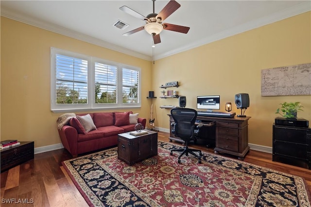 home office featuring dark wood-style floors, baseboards, visible vents, and ornamental molding