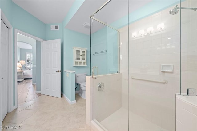 full bath featuring tile patterned flooring, visible vents, a shower stall, and toilet