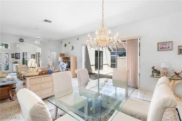 dining area featuring tile patterned floors, visible vents, and ceiling fan with notable chandelier