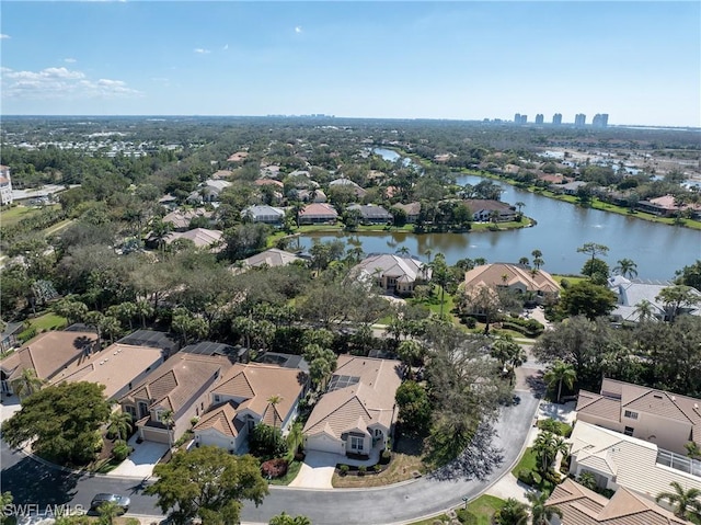 birds eye view of property featuring a water view and a residential view