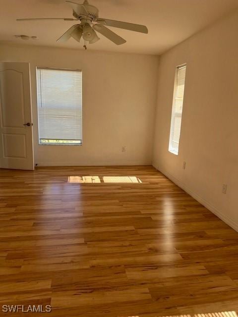 unfurnished room with light wood-style flooring and a ceiling fan