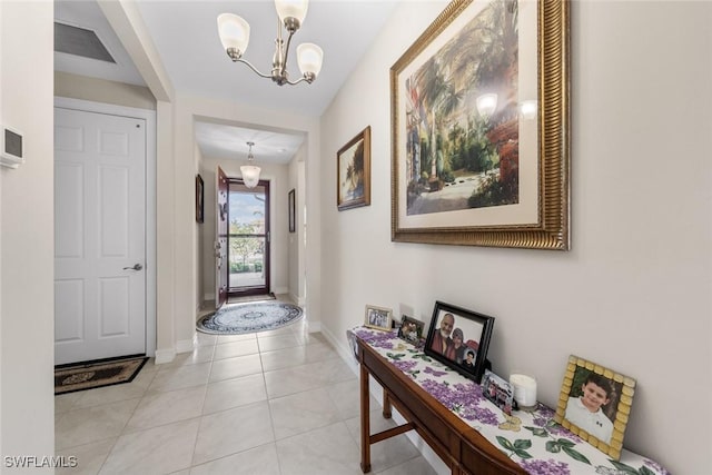 4178 Bloomfield St, Fort Myers, FL 33916 - entryway featuring a chandelier, baseboards, and light tile patterned flooring