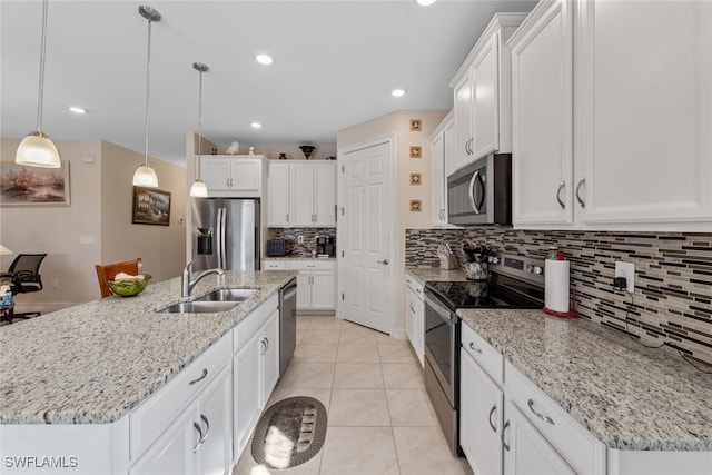 4178 Bloomfield St, Fort Myers, FL 33916 - kitchen with appliances with stainless steel finishes, a sink, backsplash, white cabinetry, and recessed lighting