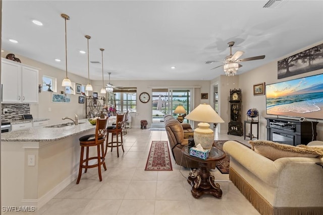 4178 Bloomfield St, Fort Myers, FL 33916 - living area featuring a ceiling fan, recessed lighting, light tile patterned floors, and baseboards