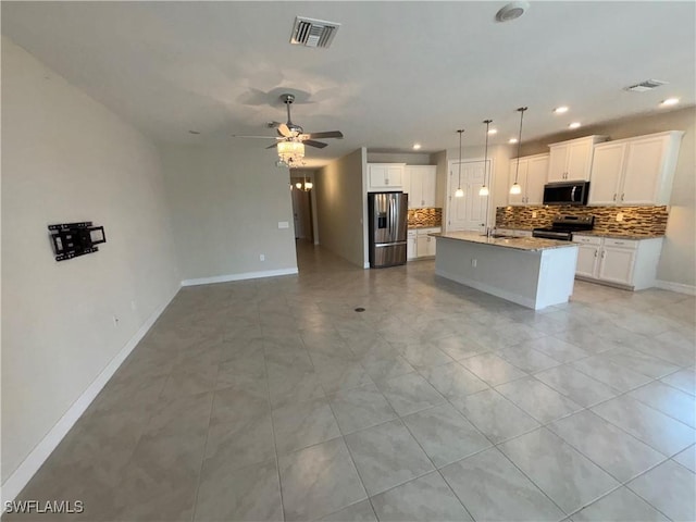 4178 Bloomfield St, Fort Myers, FL 33916 - kitchen featuring appliances with stainless steel finishes, tasteful backsplash, a ceiling fan, open floor plan, and a sink