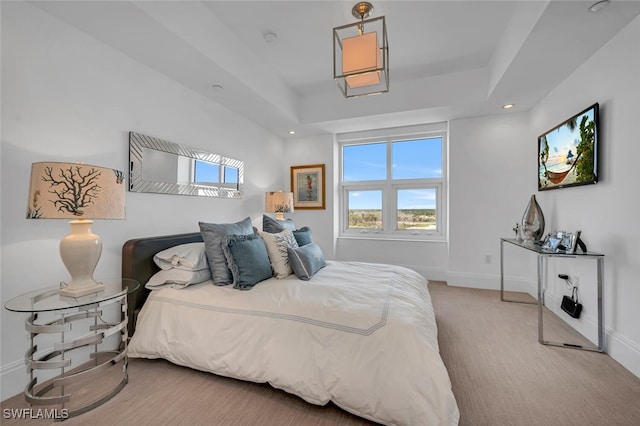 bedroom with baseboards, a raised ceiling, carpet flooring, and recessed lighting