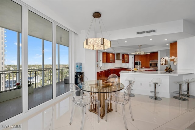 dining area featuring recessed lighting, visible vents, and light tile patterned floors