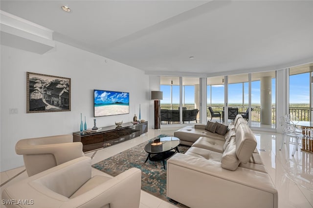 living room featuring a wall of windows and recessed lighting