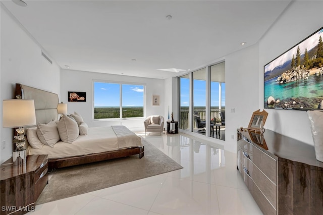 bedroom featuring visible vents, floor to ceiling windows, access to outside, and tile patterned floors