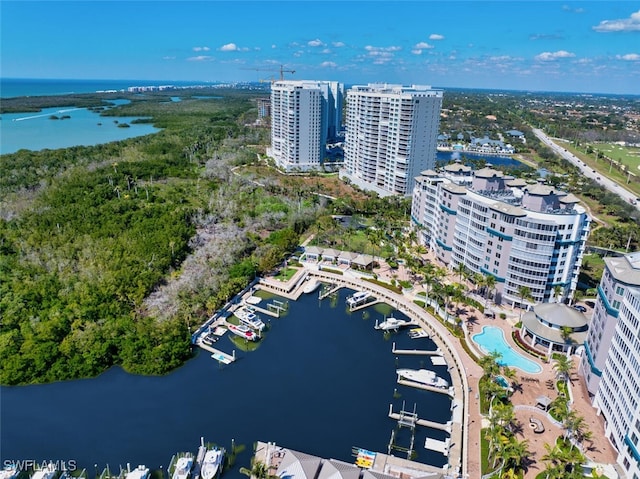 birds eye view of property with a water view and a view of city