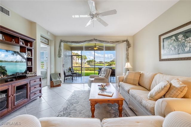 living room featuring visible vents, a ceiling fan, and light tile patterned flooring