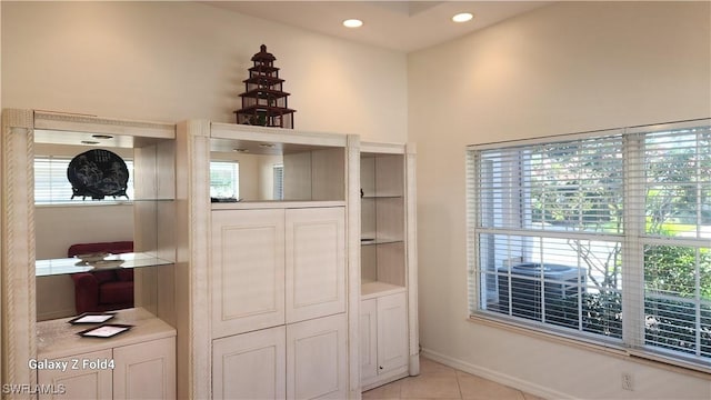 interior space with light tile patterned floors and recessed lighting