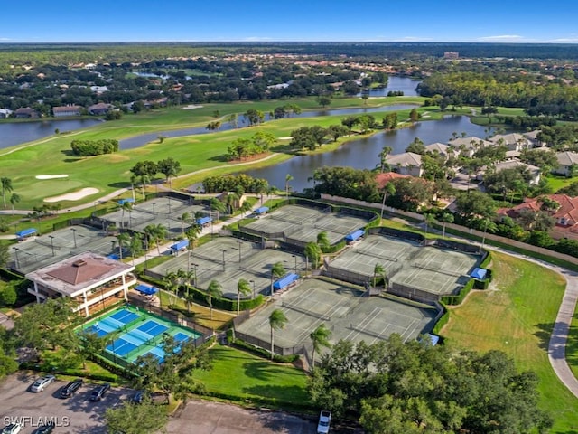 aerial view with a water view and view of golf course