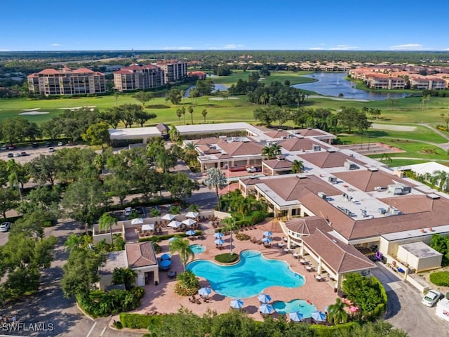 bird's eye view featuring golf course view, a water view, and a residential view