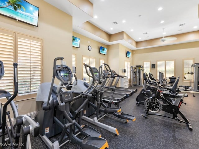 exercise room featuring recessed lighting, visible vents, and baseboards