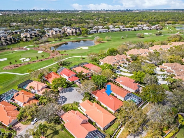 aerial view featuring a residential view, view of golf course, and a water view