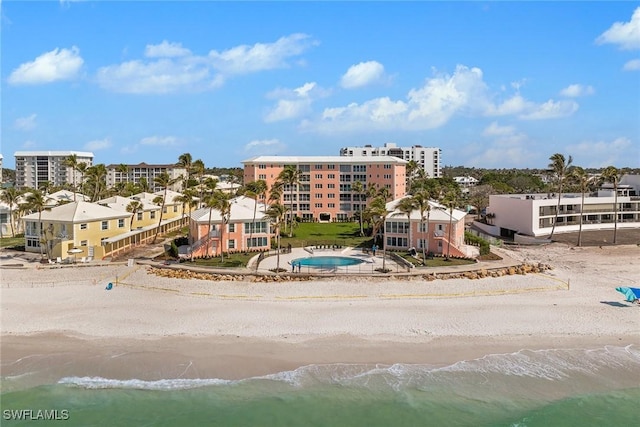 bird's eye view with a water view and a view of the beach