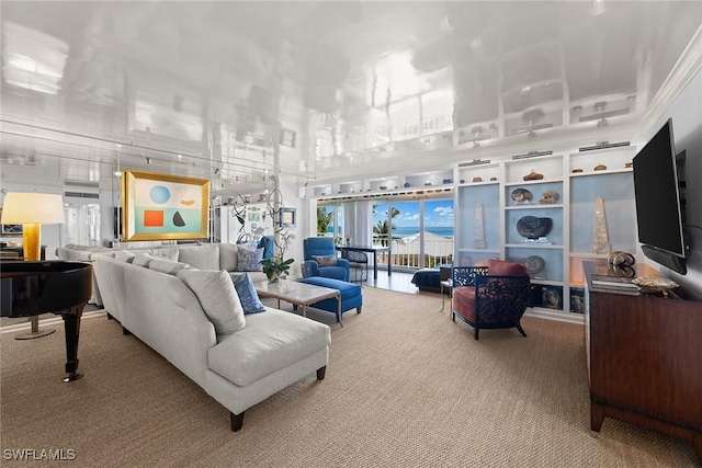 living area with light carpet and a towering ceiling