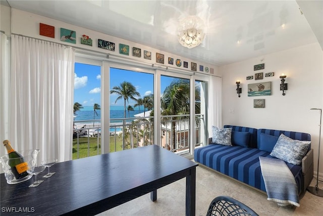 interior space featuring a water view and a beach view