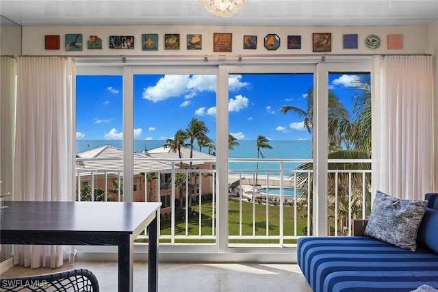 unfurnished sunroom with a water view