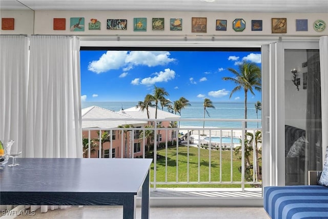 doorway to outside featuring a water view