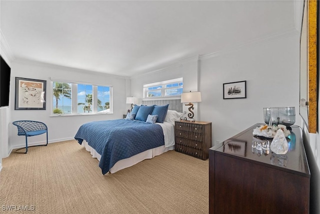 bedroom with light carpet, crown molding, and baseboards