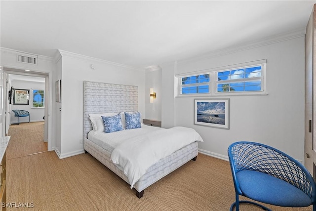 bedroom featuring baseboards, light colored carpet, visible vents, and crown molding