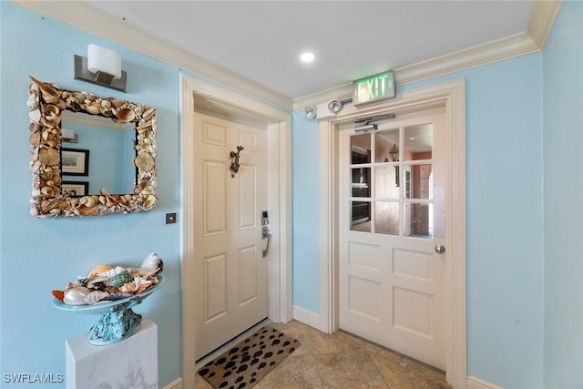 doorway to outside with ornamental molding and baseboards