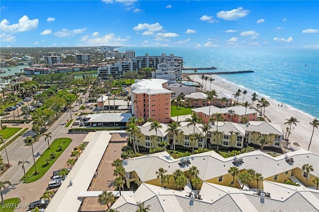 bird's eye view featuring a view of city, a beach view, and a water view