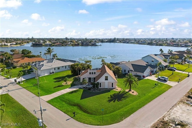 bird's eye view featuring a residential view and a water view