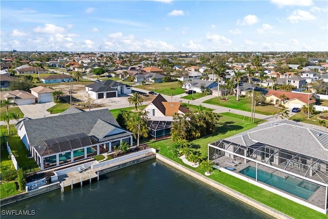 aerial view with a residential view and a water view