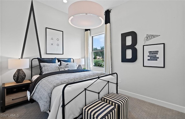 bedroom featuring carpet floors and baseboards